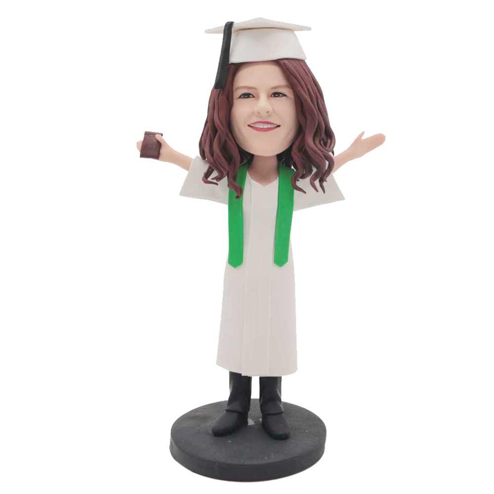 Custom Female Graduation Bobbleheads In White Gown And Green Ribbon