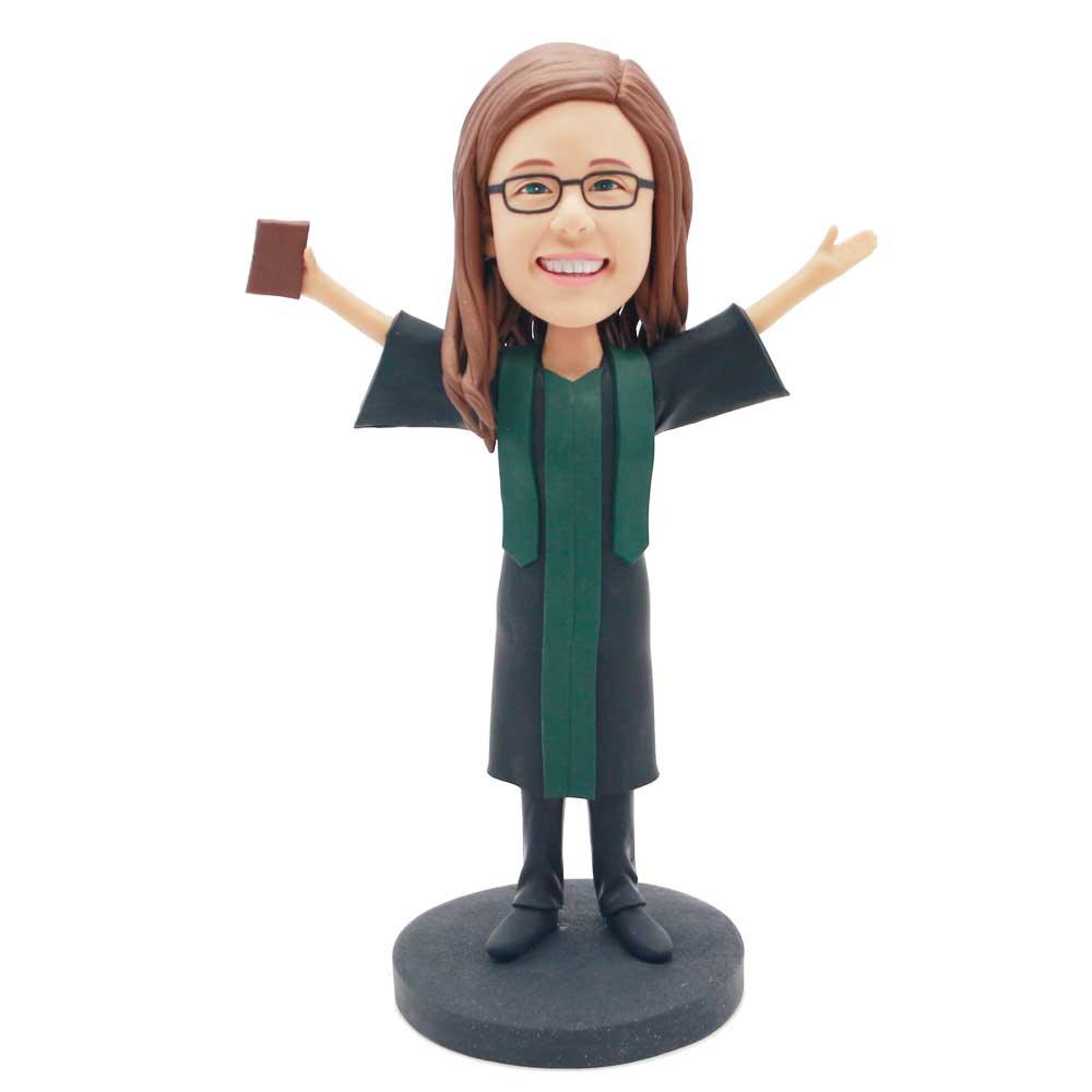 Custom Female Graduation Bobbleheads In Black Gown With Dark Green Ribbon