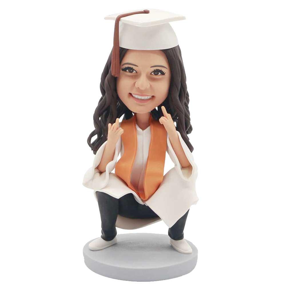 Custom Female Graduation Bobbleheads In White Gown And Orange Ribbon