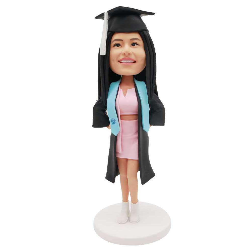 Custom Happy Female Graduation Bobbleheads In Black Gown And Pink Skirt