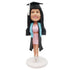 Custom Happy Female Graduation Bobbleheads In Black Gown And Pink Skirt